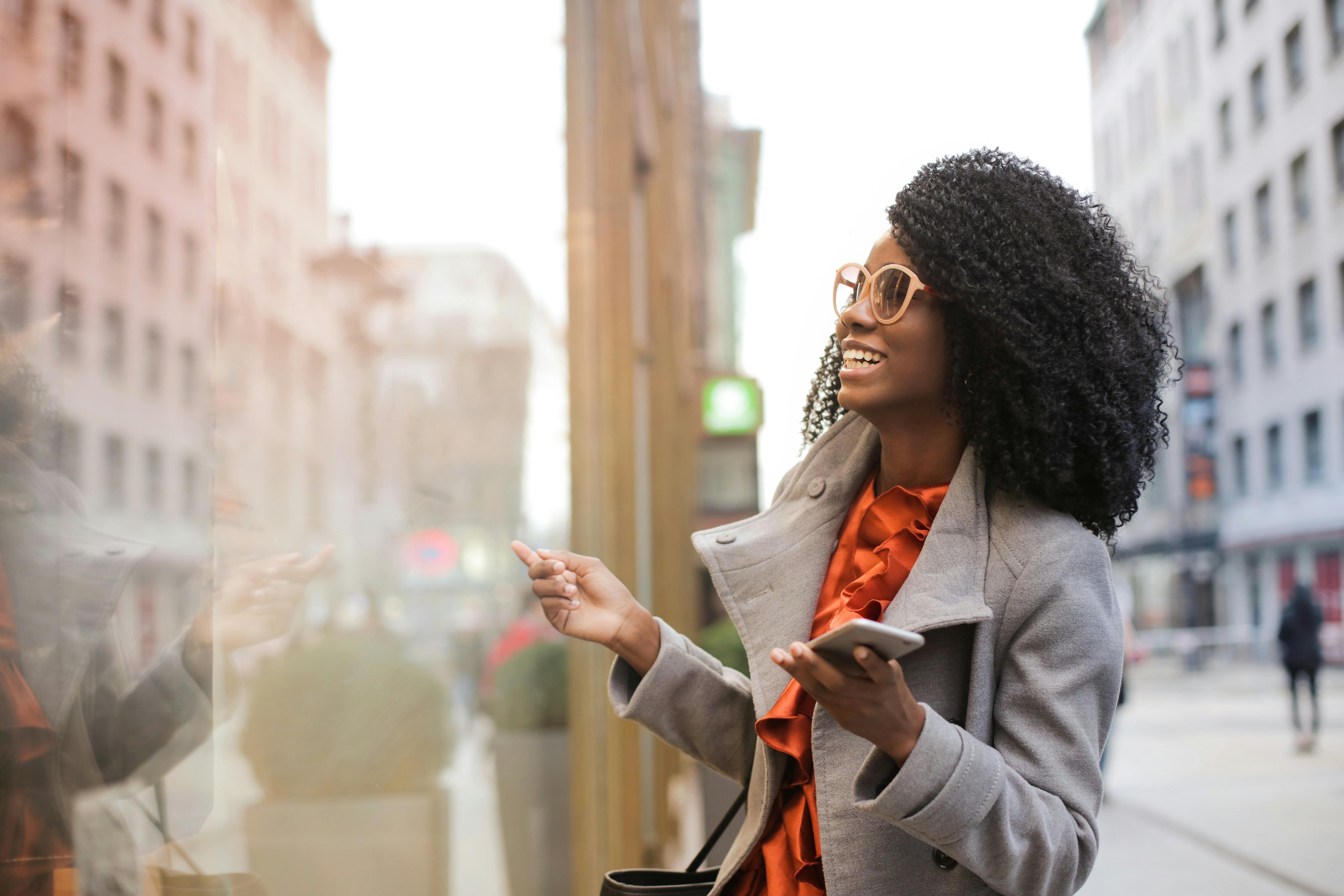 Women looking happily at window